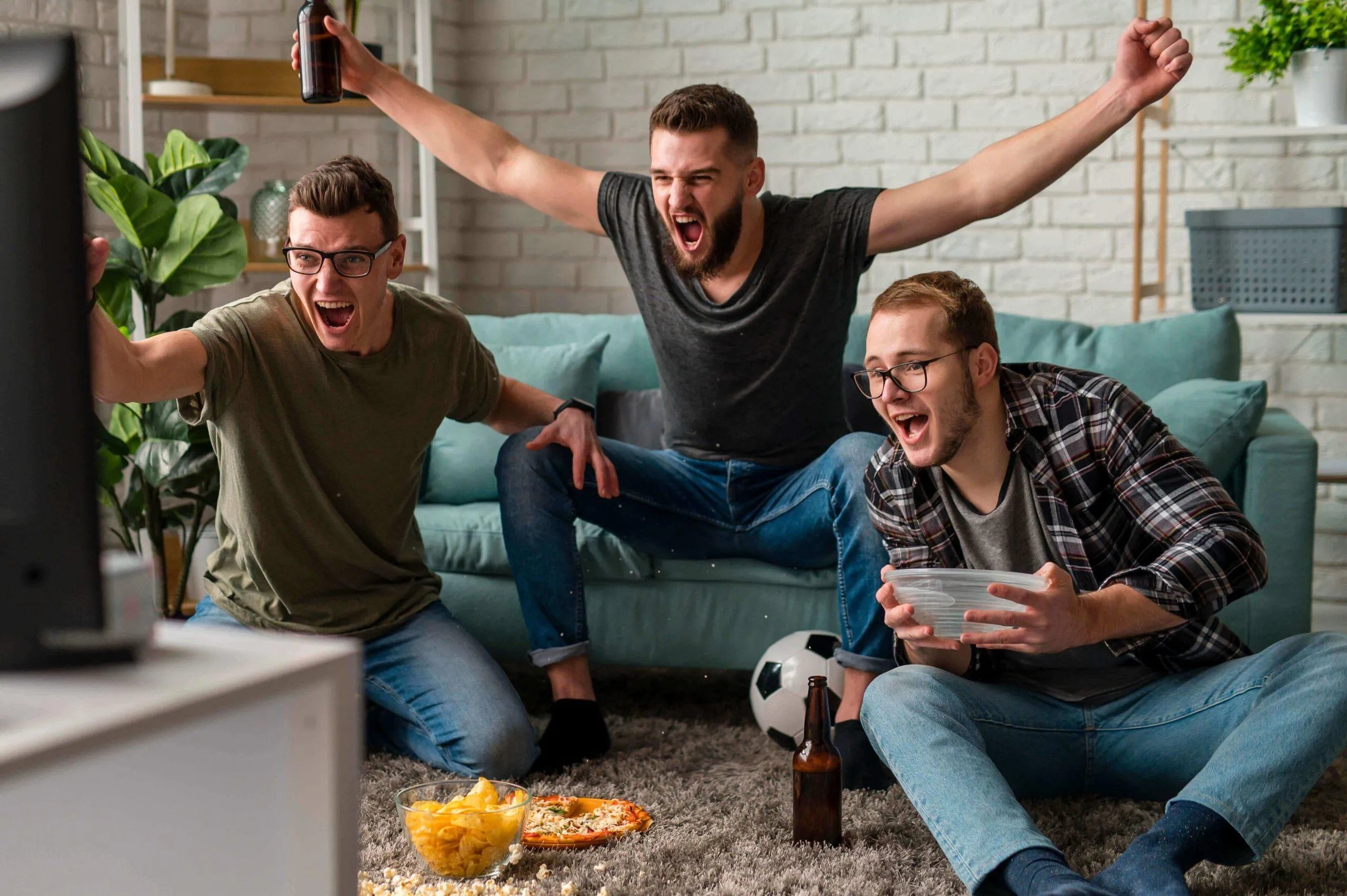 Friends watching sports TV together